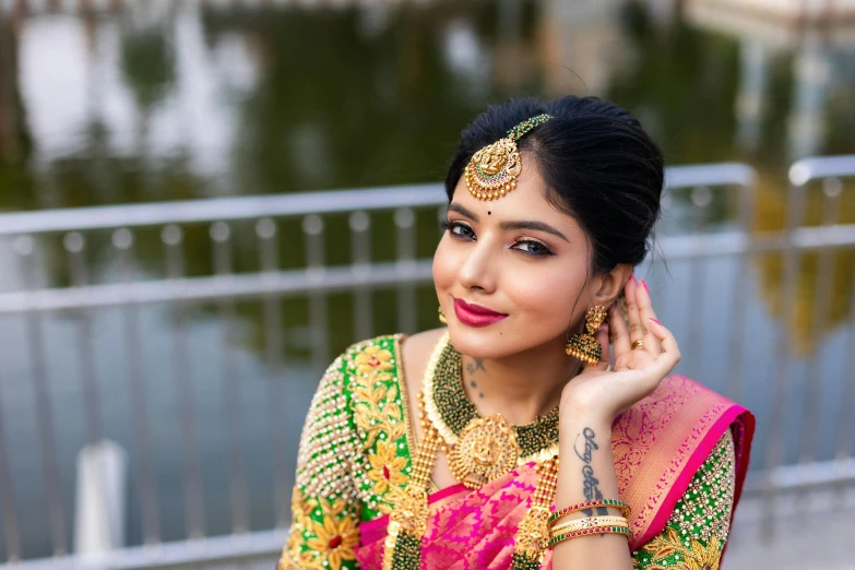 beautiful woman wearing a bright green blouse in traditional indian wear