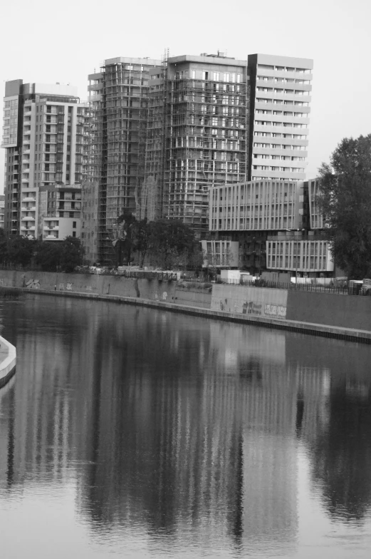 a large body of water in front of some buildings