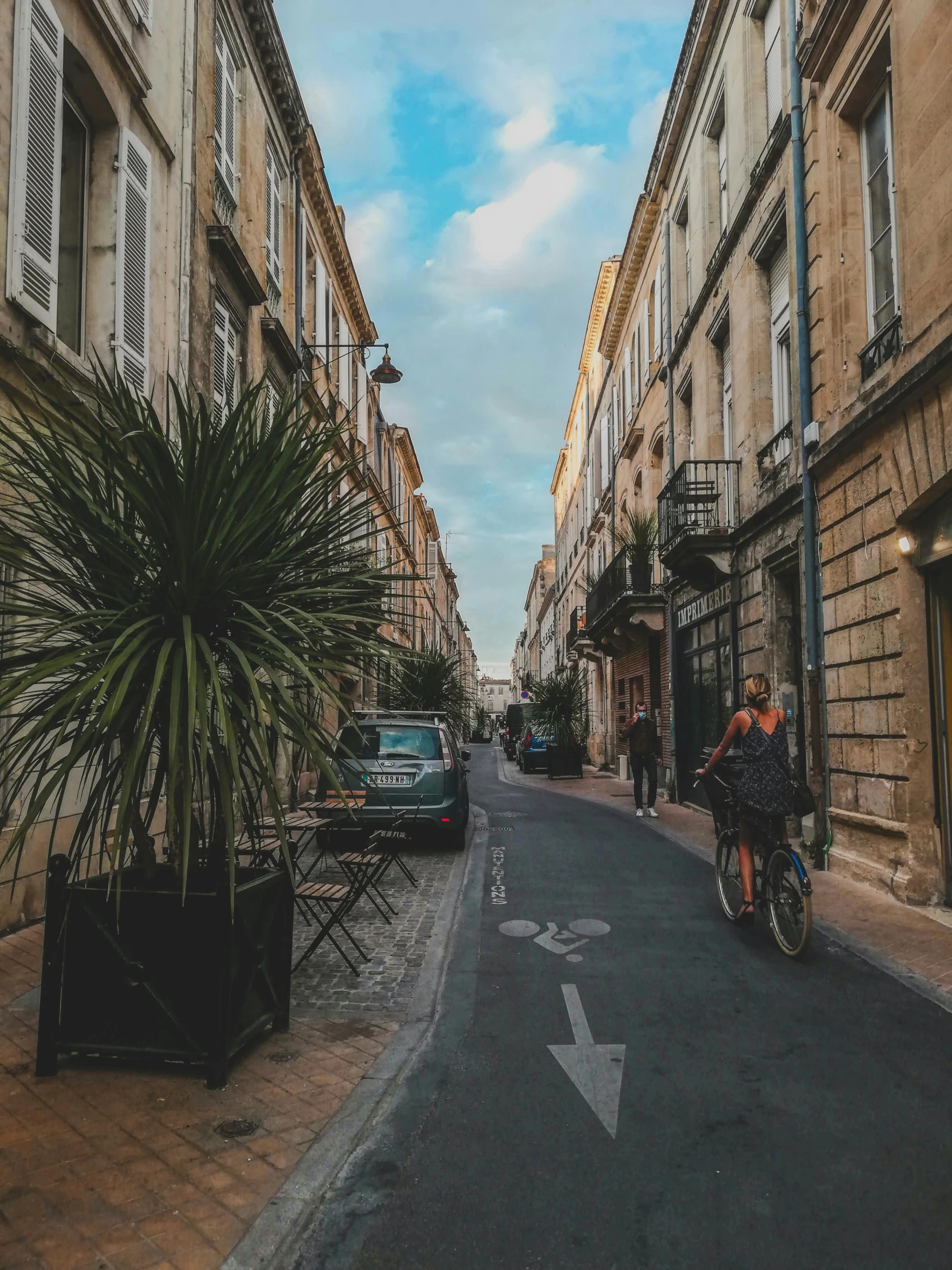 a guy riding his bike down the street in the city