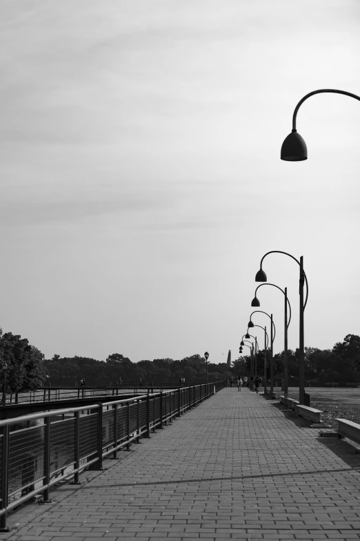 a sidewalk that has lights on it