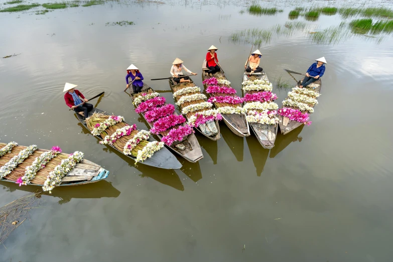 boats are shown with flowers on the end