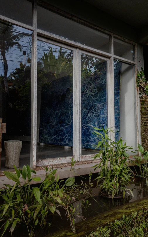 an old building with a broken glass front window