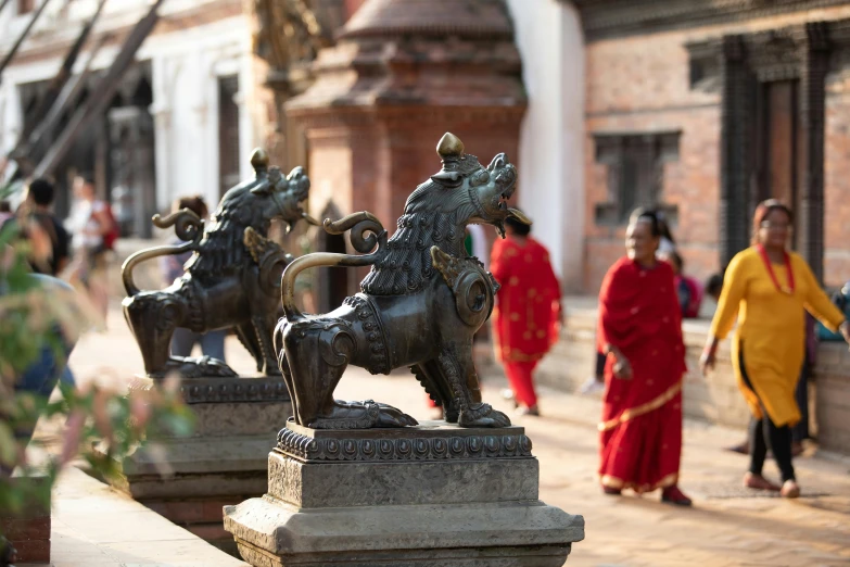 statue of two horses on a stone ledge