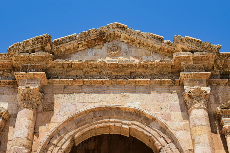 a large stone building with a clock at the top