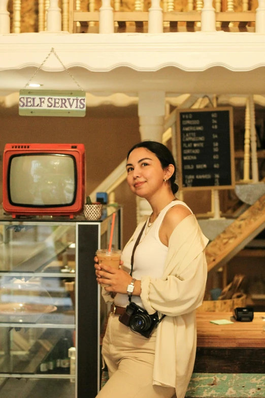 an asian woman sitting on top of a table