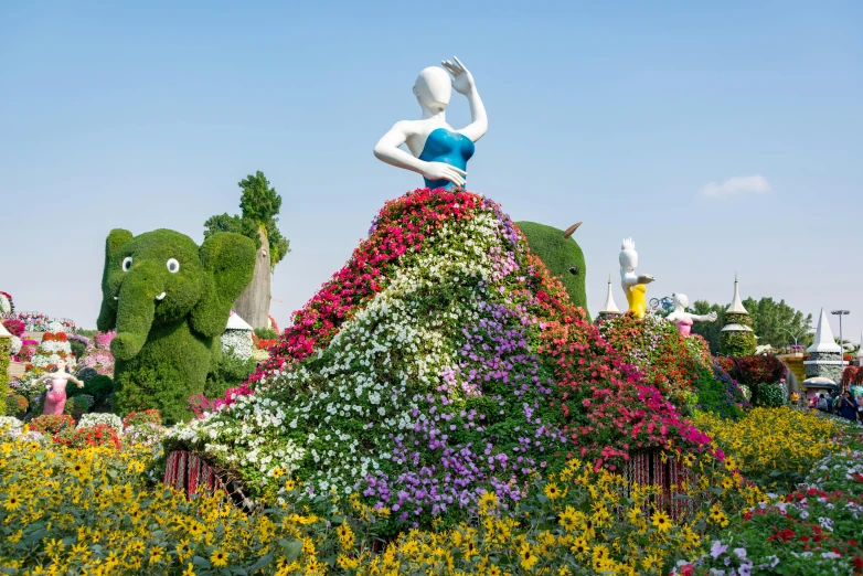 the flower display at disneyland has multiple flowered statues