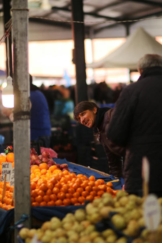 a market with various types of fruit being sold