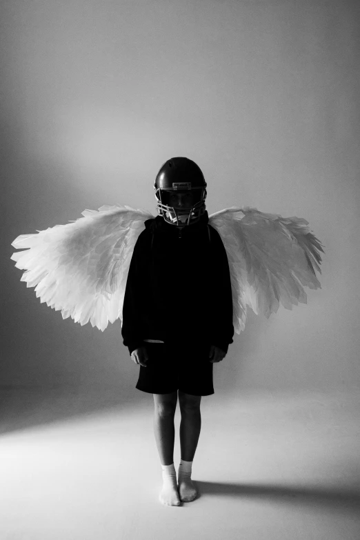 a woman with wings standing on a white background