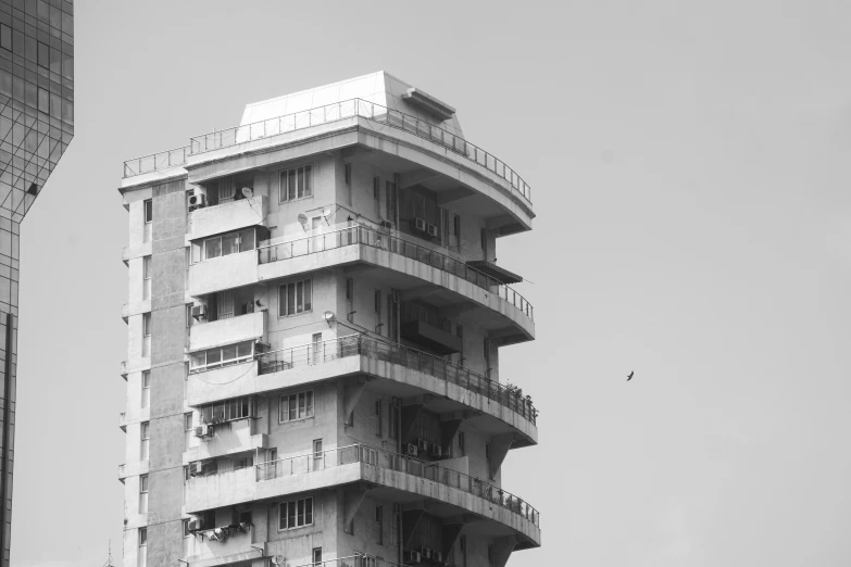 a high rise building against a gray sky