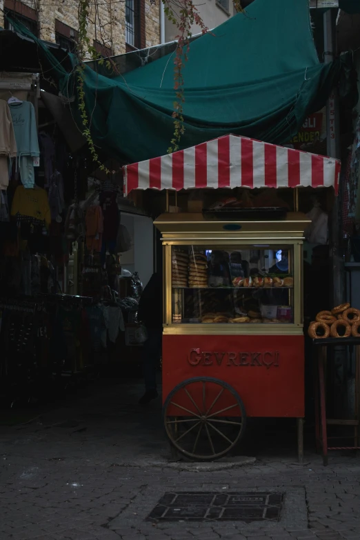 the small cart is selling sweets for sale