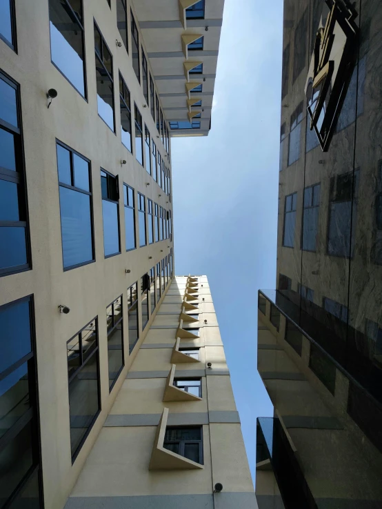 an upward view of two building side by side