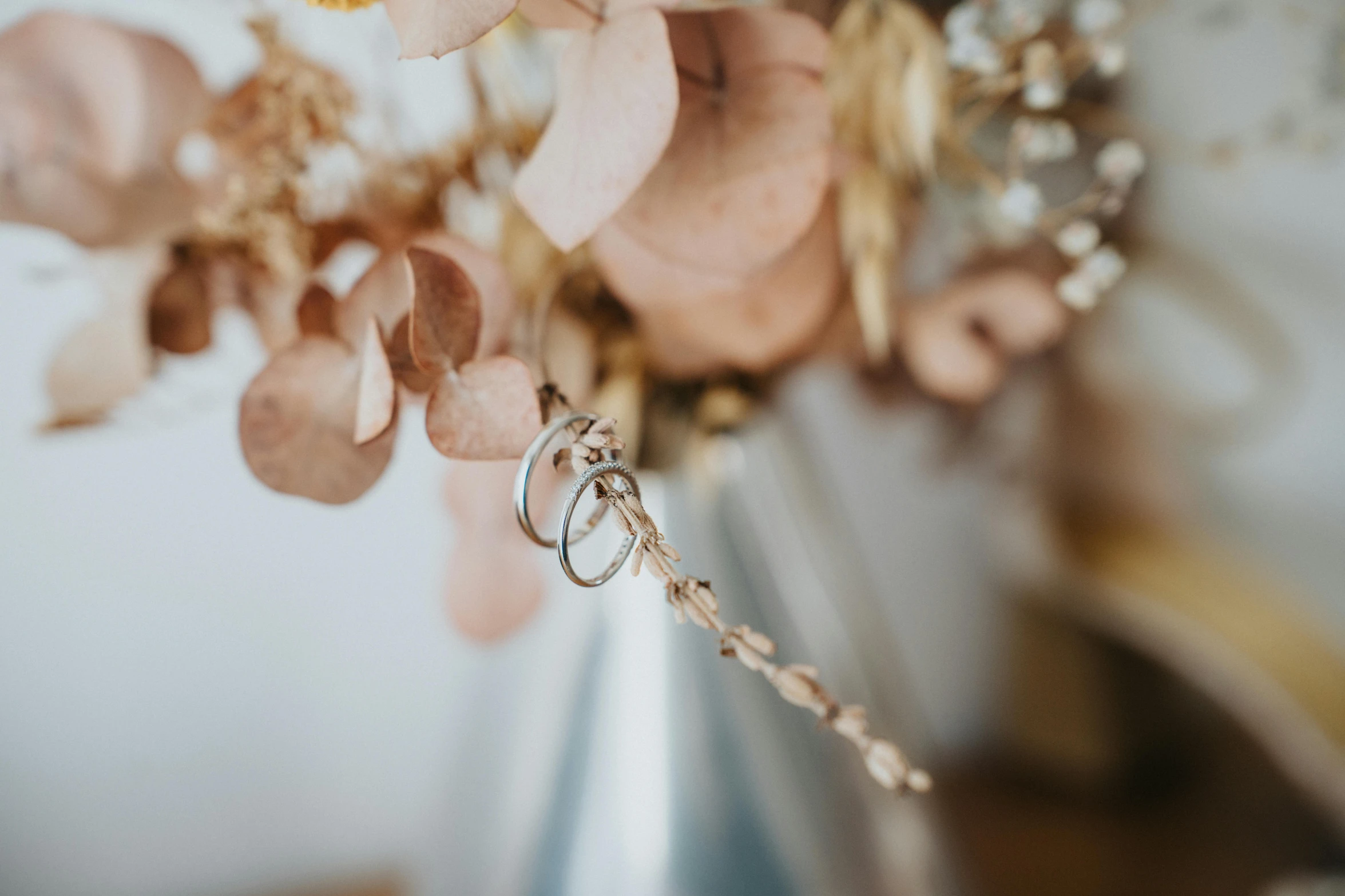 some kind of flower bouquet with rings attached