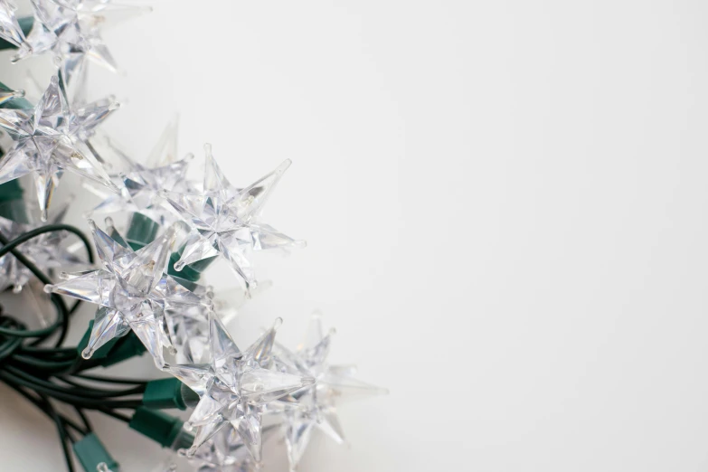 some white and green christmas lights on the ground