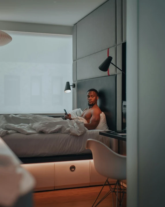 a woman sitting in bed with a laptop