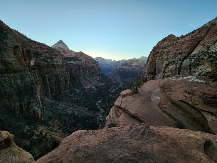 an overlook of a mountain with steep cliffs