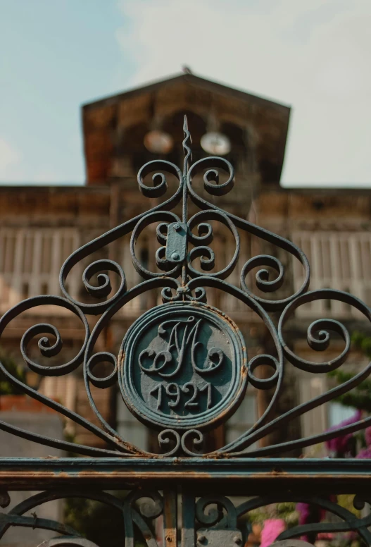 the letters are in a decorative wrought - iron design