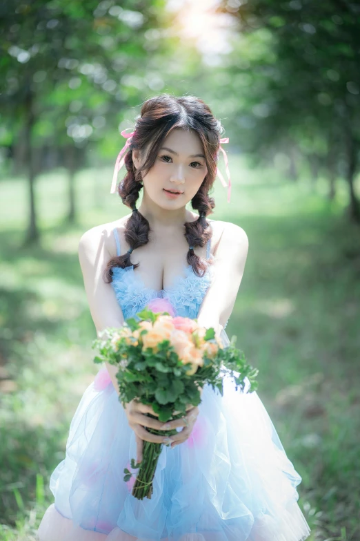 a  wearing a dress holding flowers