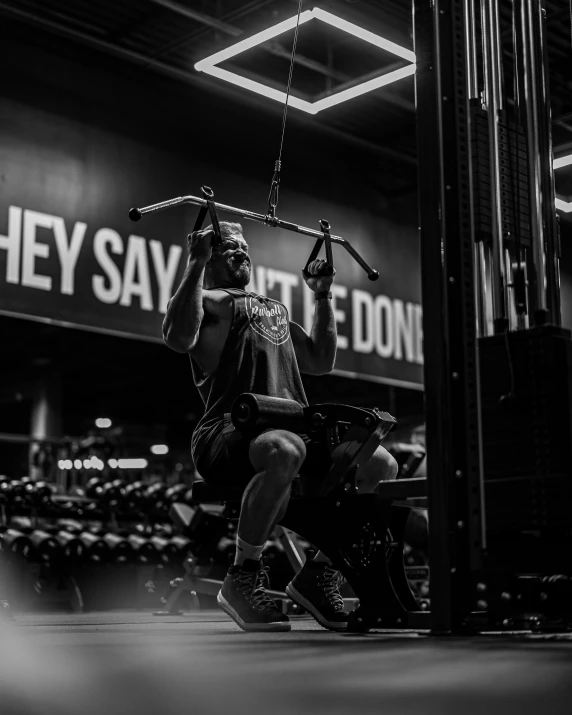 a person in the middle of doing deadlifts