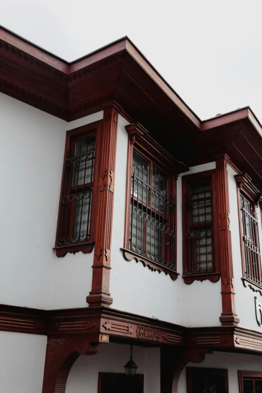 the corner of a building with some windows on top of it