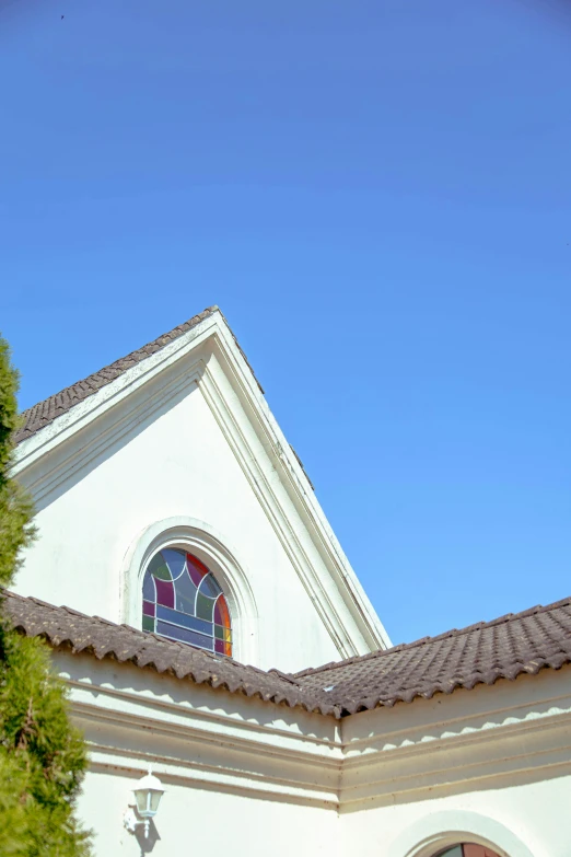 there is a church building with a sky background