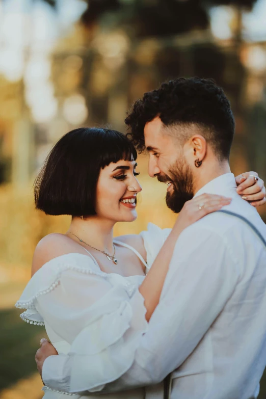 a man and woman smiling at each other