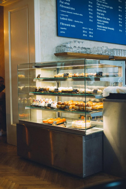 a donut stand displays different donuts in a store