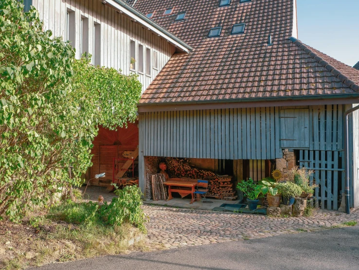 an old style barn house with a lot of wood