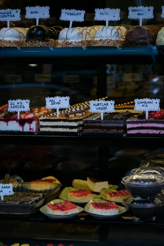 assortment of desserts and pastries displayed on shelves