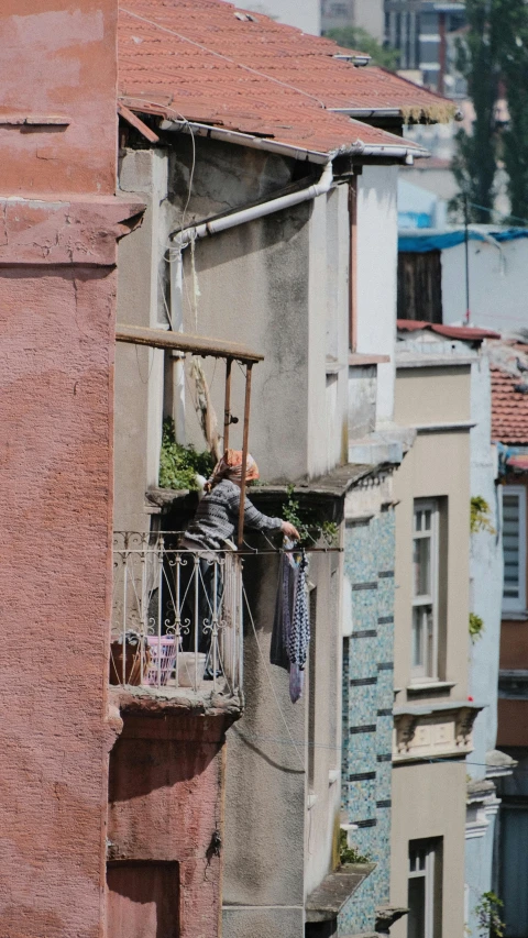 this balcony has some clothes hanging on it