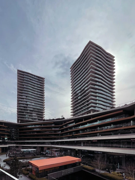 two buildings in the distance and some cars