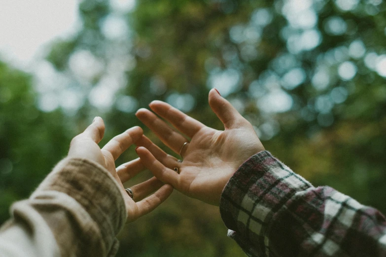 the hands are outstretched and being pographed with one hand out in front