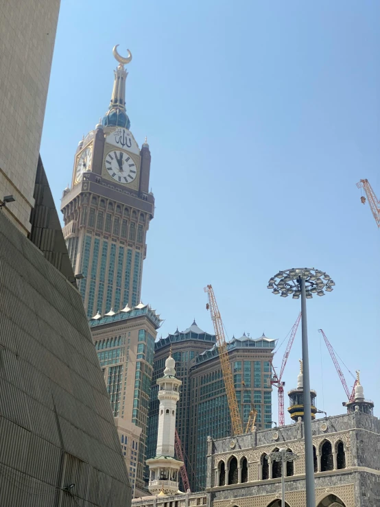 two buildings in the city with clocks on them