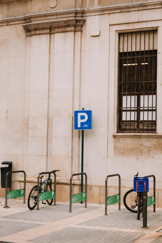 bicycle parking spots in front of a building