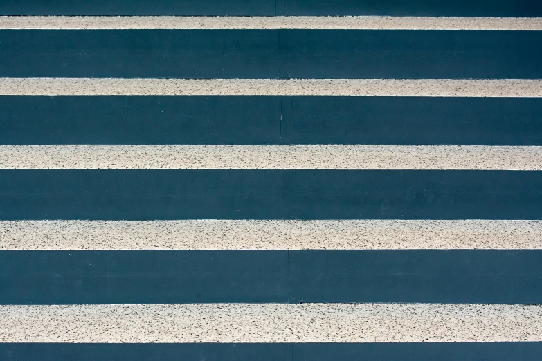 white lines painted on a blue surface with white dots