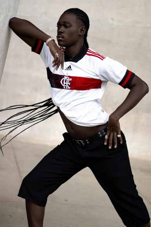 an athletic man is posing and preparing to throw a frisbee