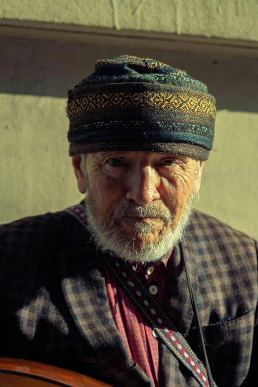 a man that is standing with a shirt and hat on