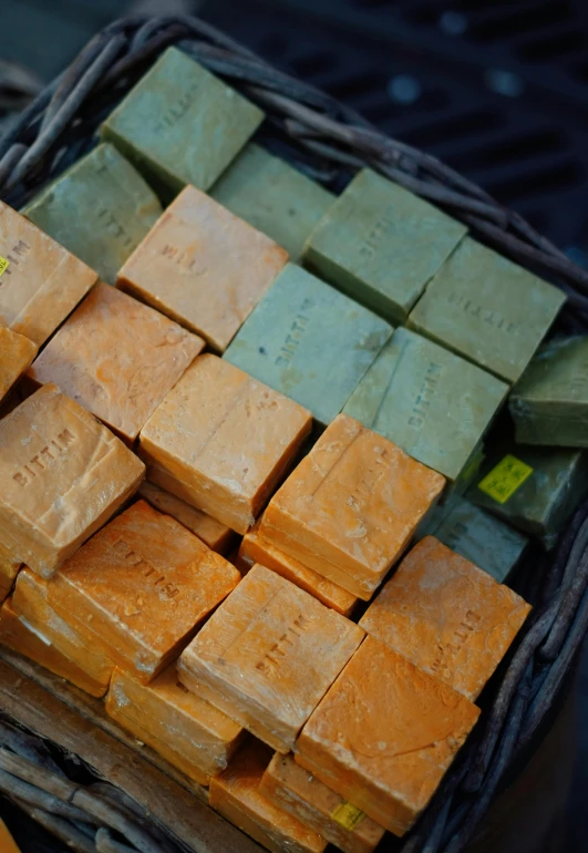 close up of soap cubes stacked in a basket