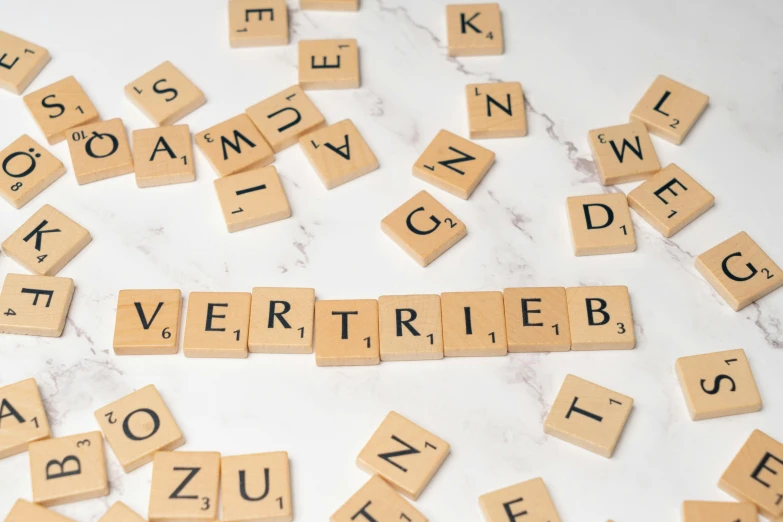 some scrabble letters that say i love you and is spelled with small wooden blocks