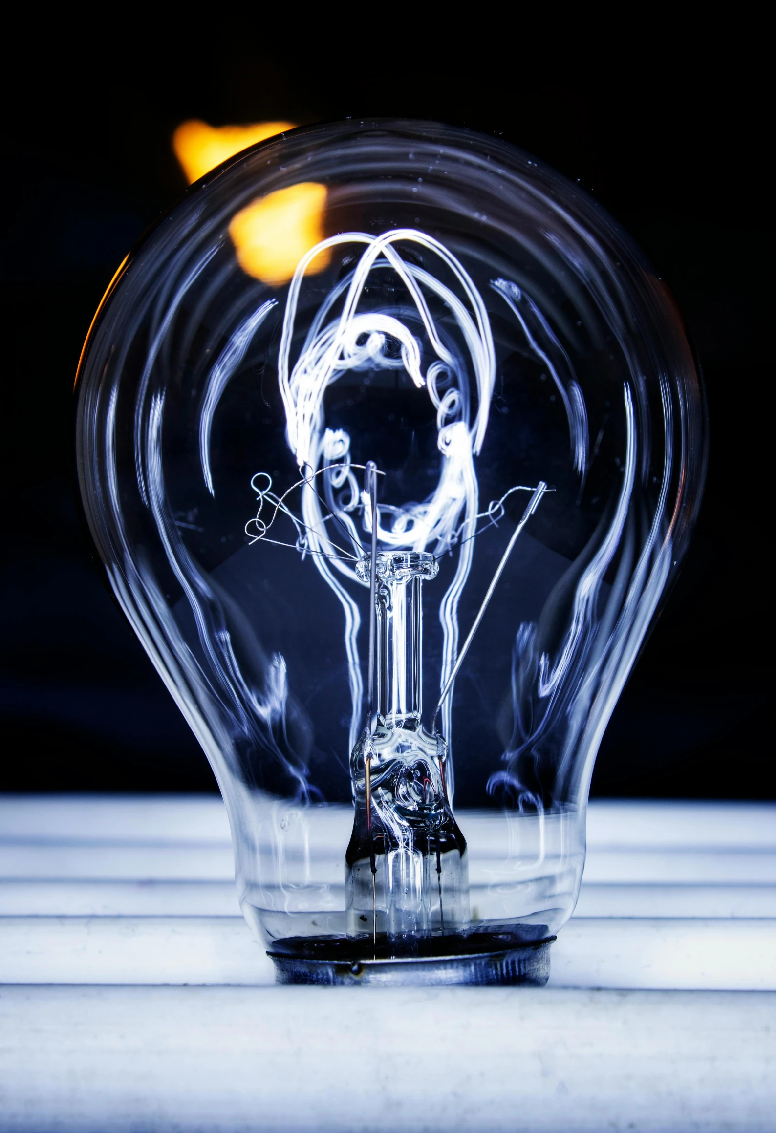 a close up of a clear bulb on a table