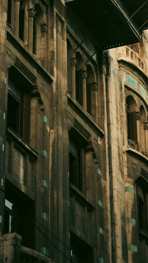 an old building with very windows and a street sign