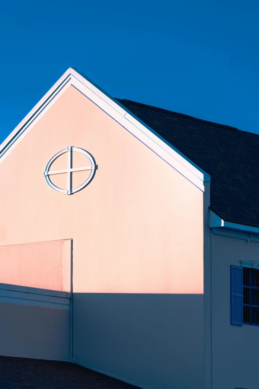 a white building with a cross on the side