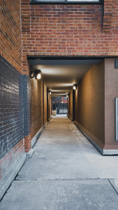 an empty long building with a red fire hydrant