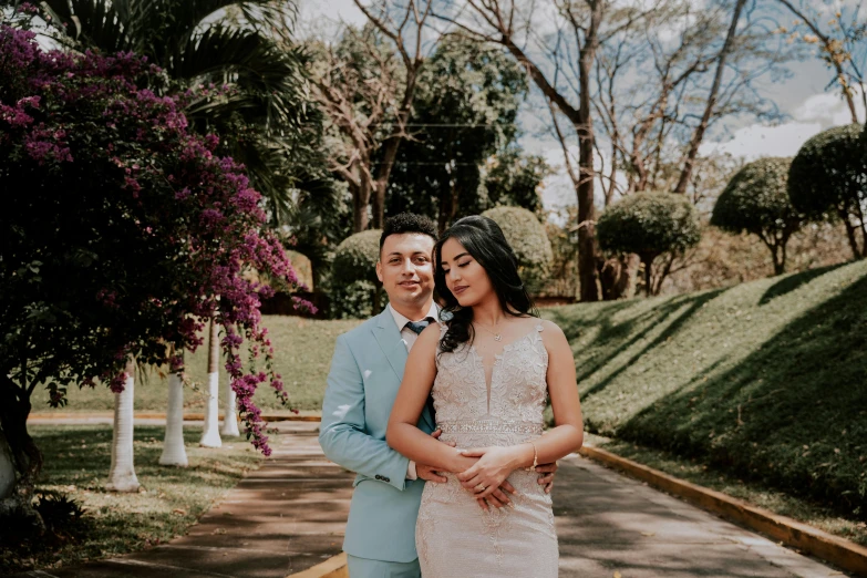 a man and woman are holding hands and posing for a po