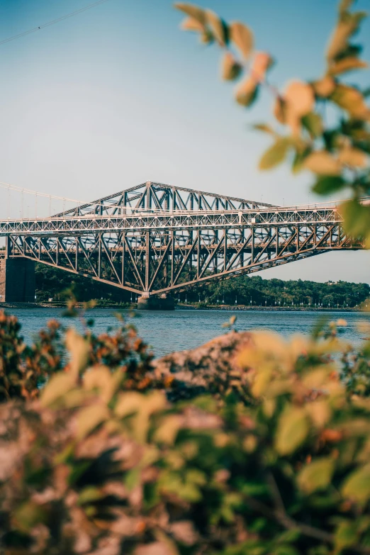 an old bridge crosses over a river