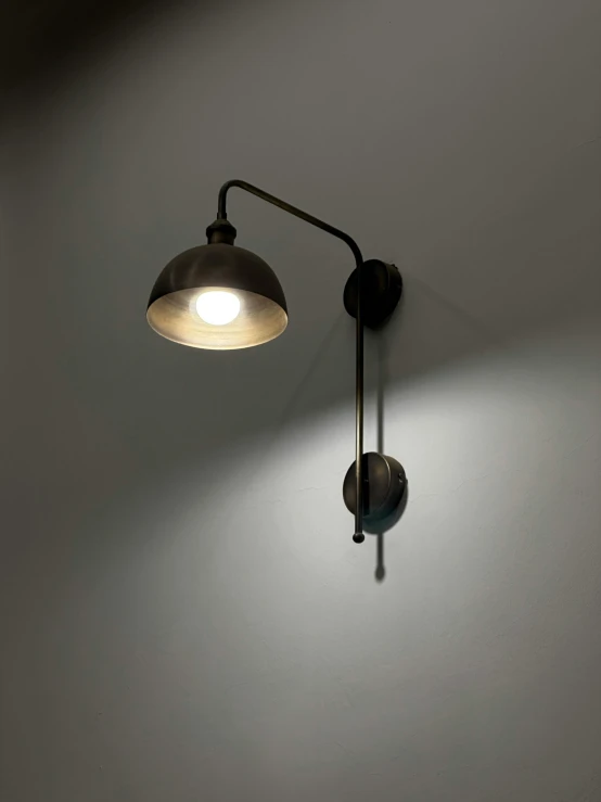 a simple gray wall mounted light fixture