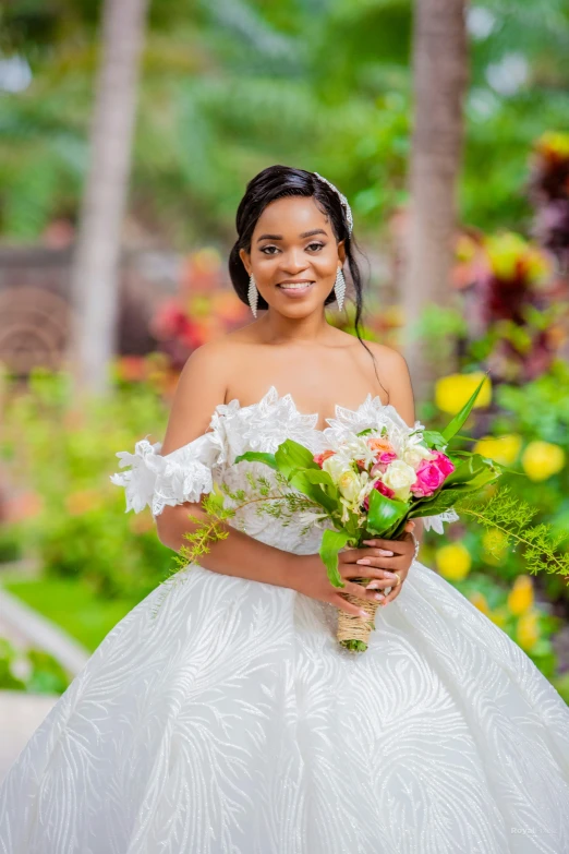 the bride is dressed in her wedding dress