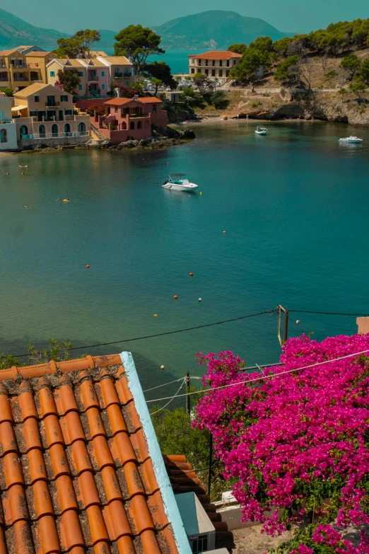 the village sits along the lake's edge with a boat in the water