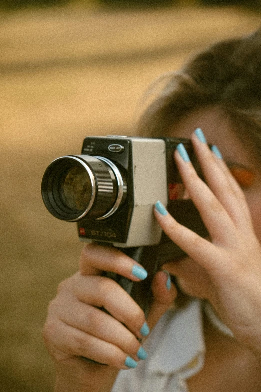 a woman taking a picture with a camera