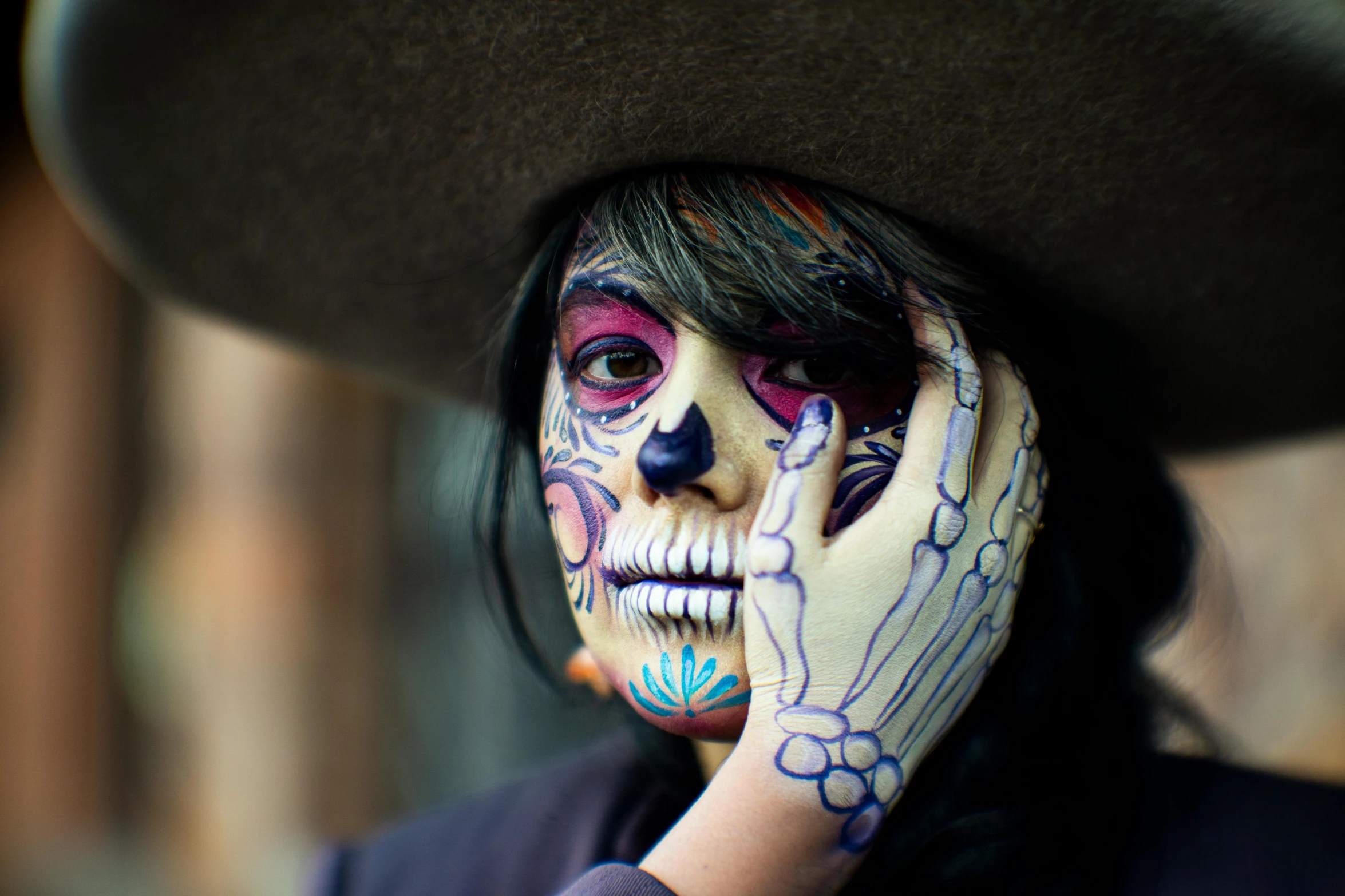 a woman with face paint and makeup on