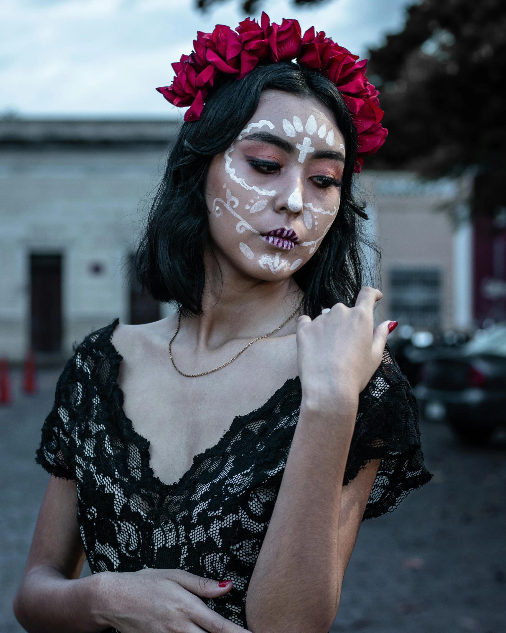 woman with her face paint artfully painted on her cheek